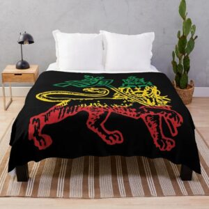 Plaid Rasta Noir Chaud et Confortable installé sur un lit dans une chambre